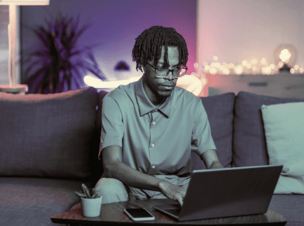 Person coding on laptop